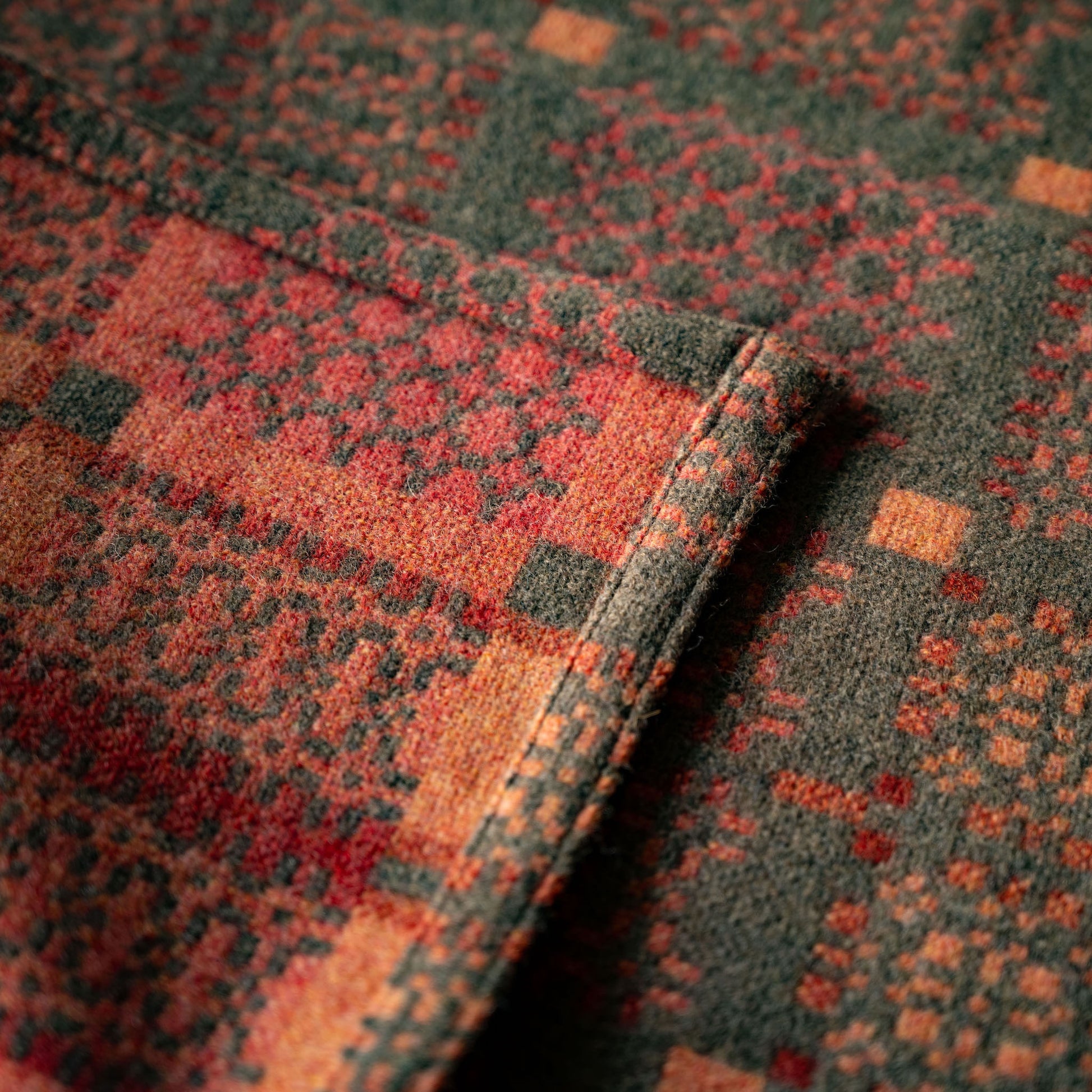 Close-up of Melin Tregwynt Knot Garden design copper colourway  both sides