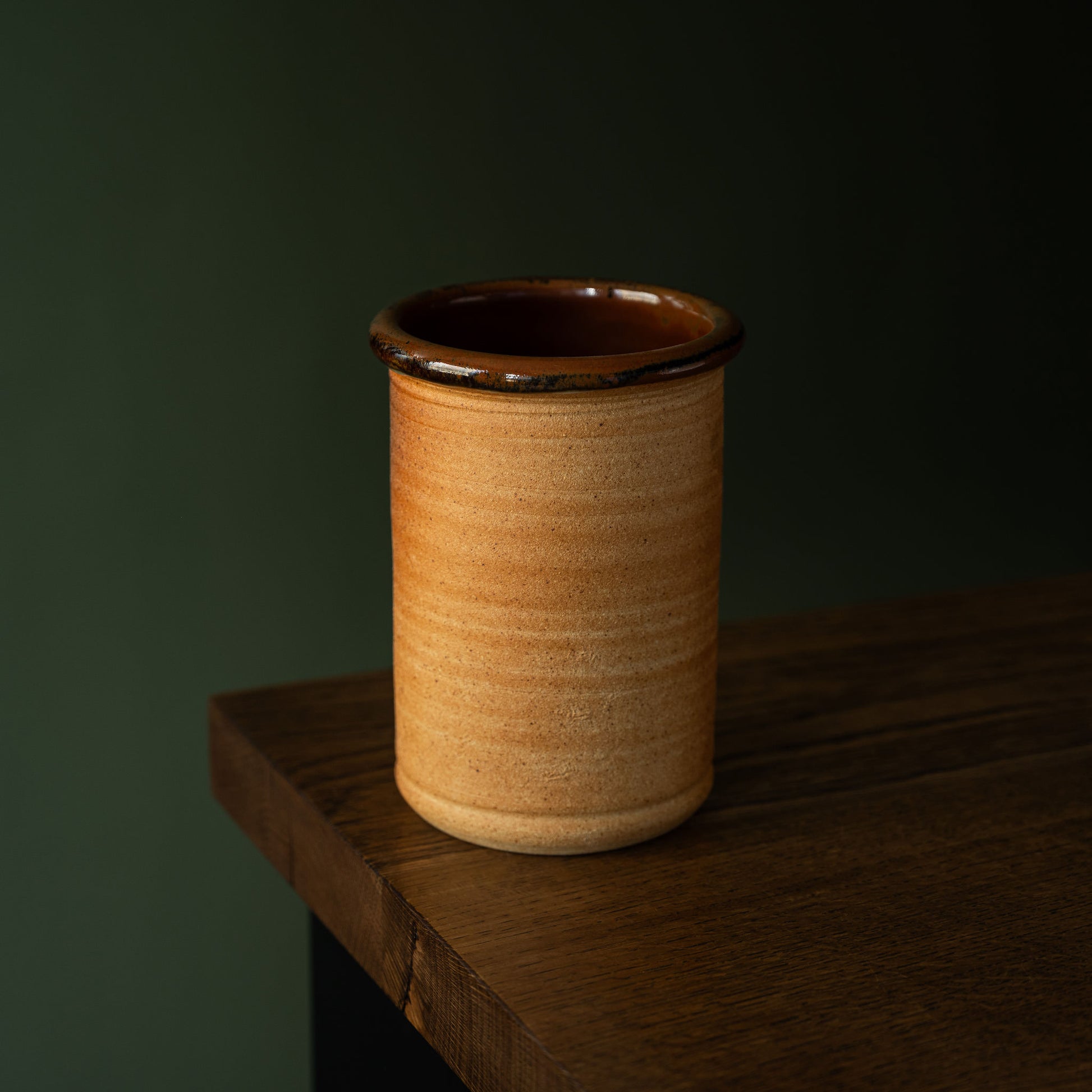 Muchelney Pottery handmade ceramic spoon / utensils holder with a wood fired biscuit glaze, featuring a dark brown rim.  