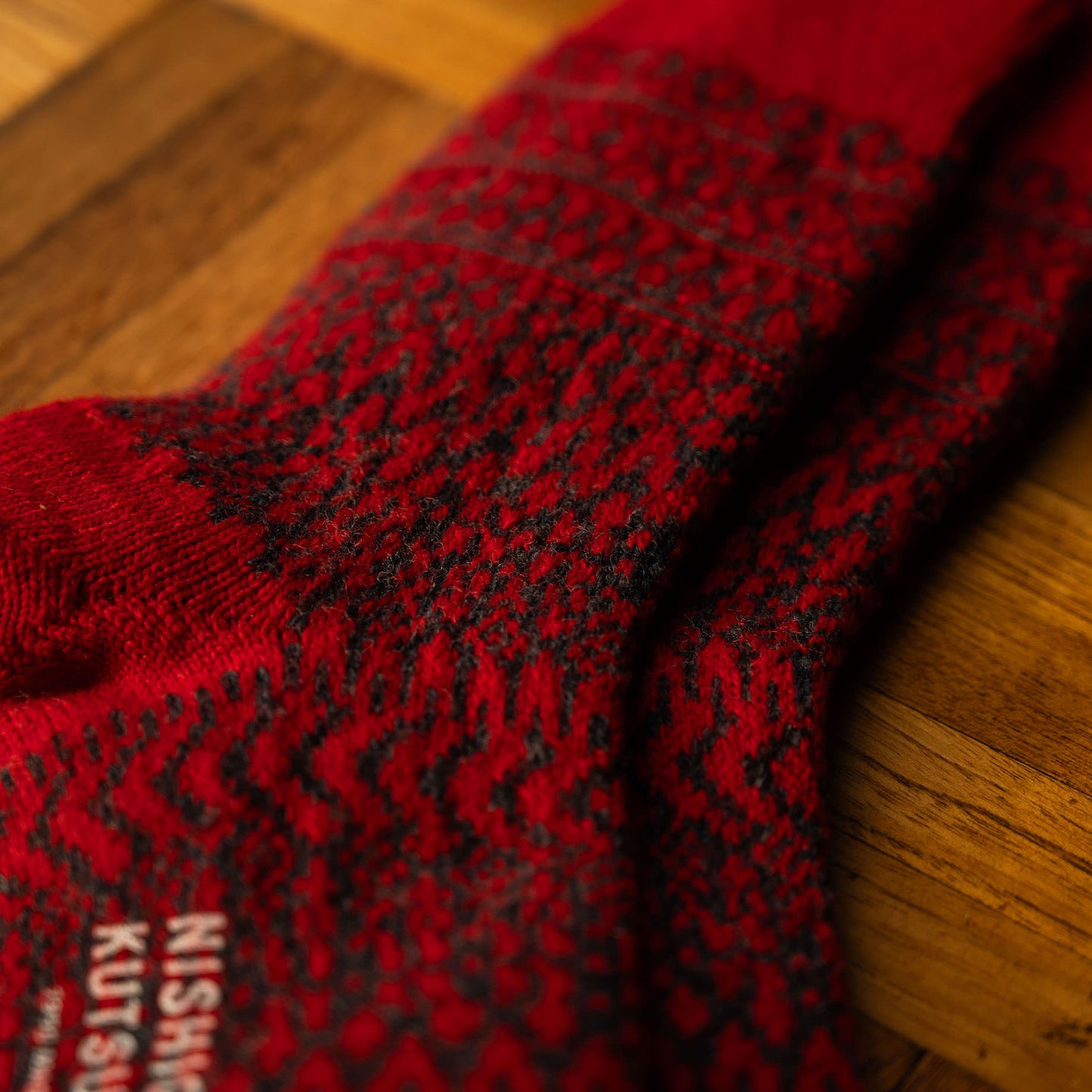 Colour & yarn detail for Red Nishiguchi Kutsushita Wool Jacquard Socks