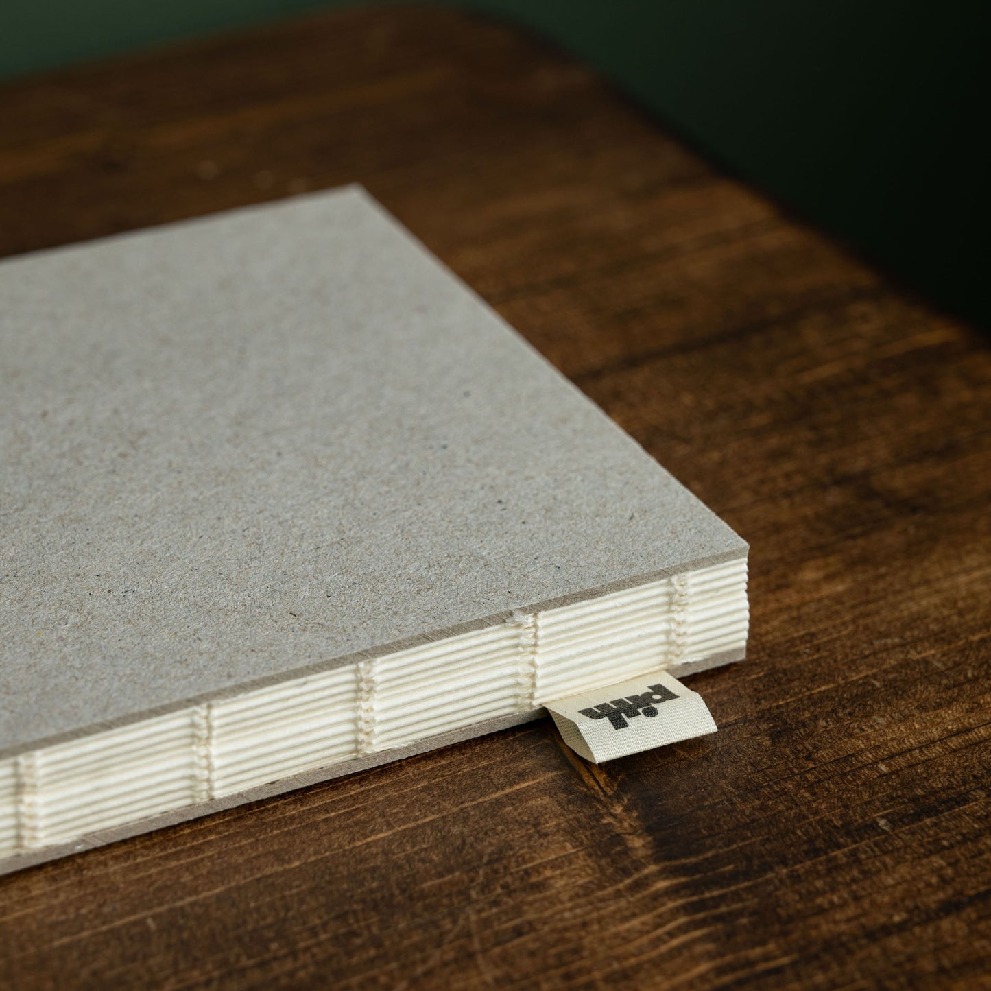 Pith Kabosu Sketchbook flat lay binding detail with cotton logo label
