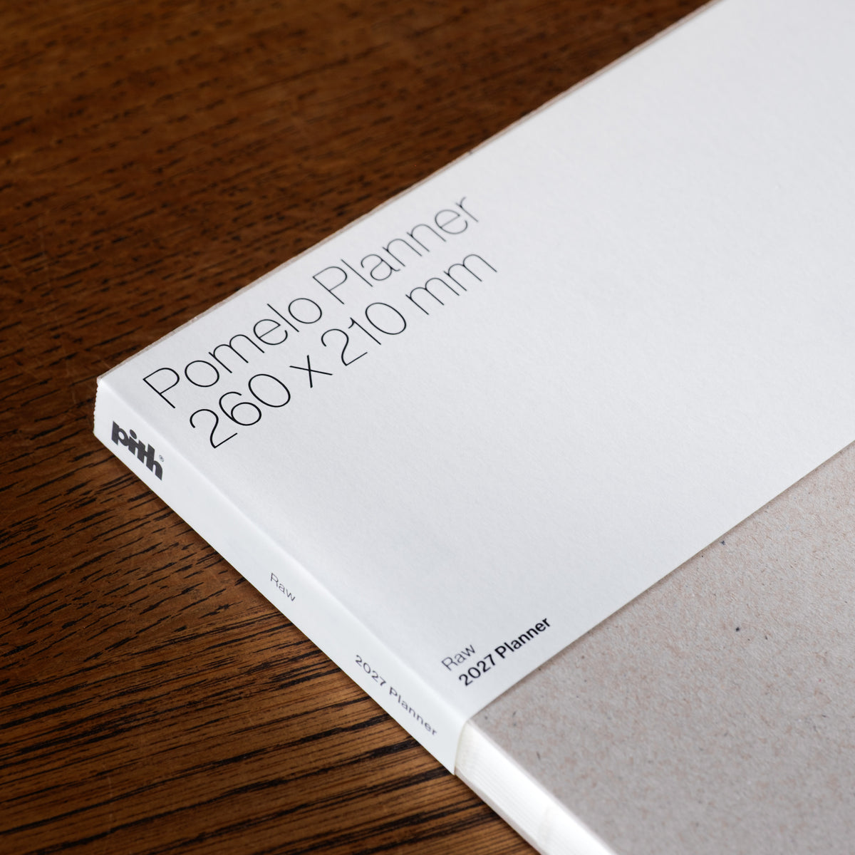 Pith Supply Pomelo 2027 Planner removable belly sleeve showing dimensions and brand logo. 