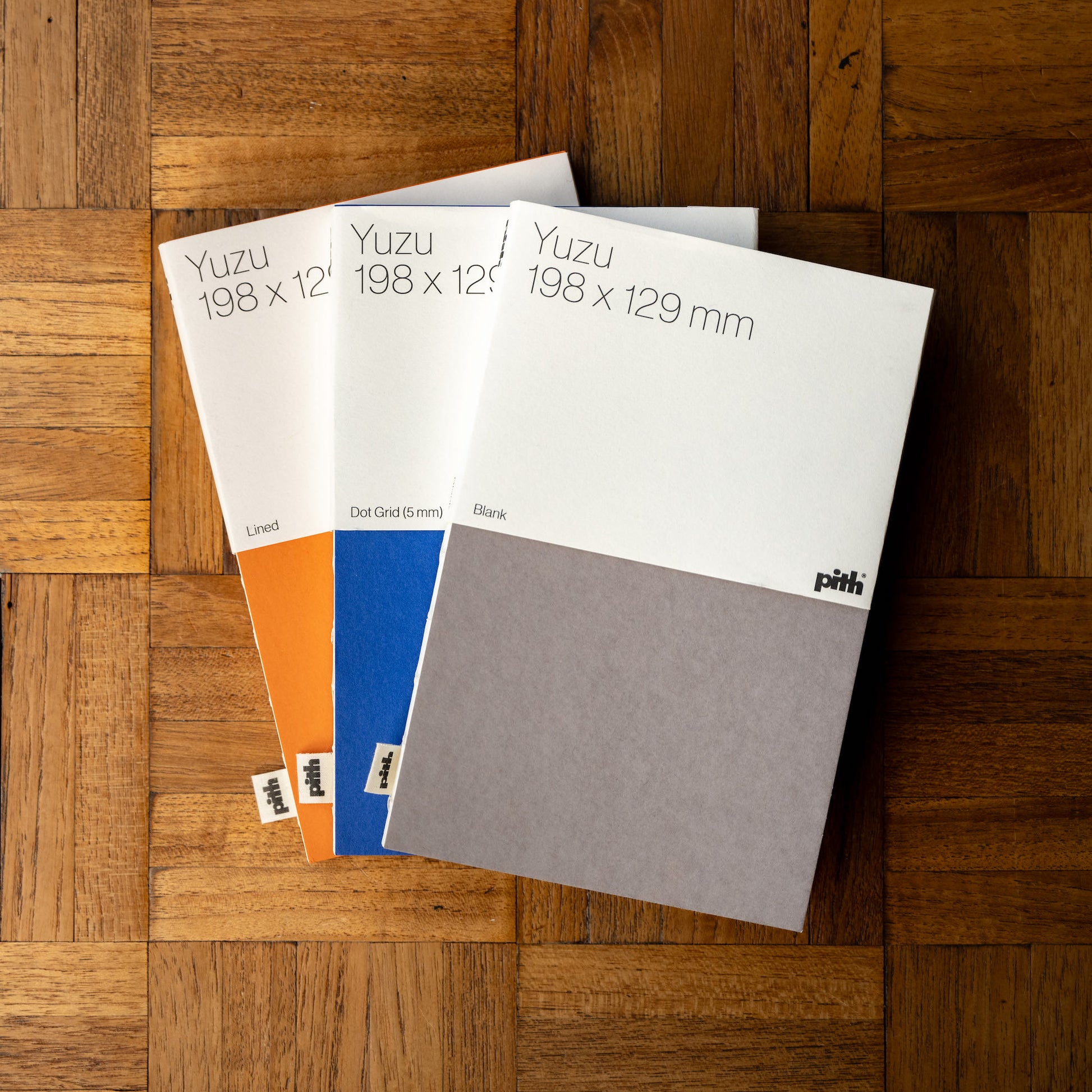 Pith Yuzu Notebooks in taupe, blue & orange