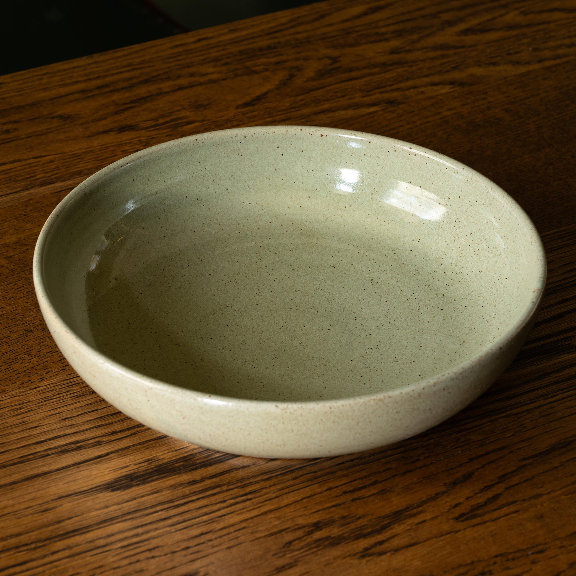 Pottery West Stoneware Serving Bowl in olive flecked glaze.