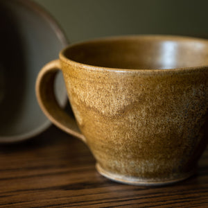 Pottery West Stoneware Curved Mug Ochre Glaze Close Up 