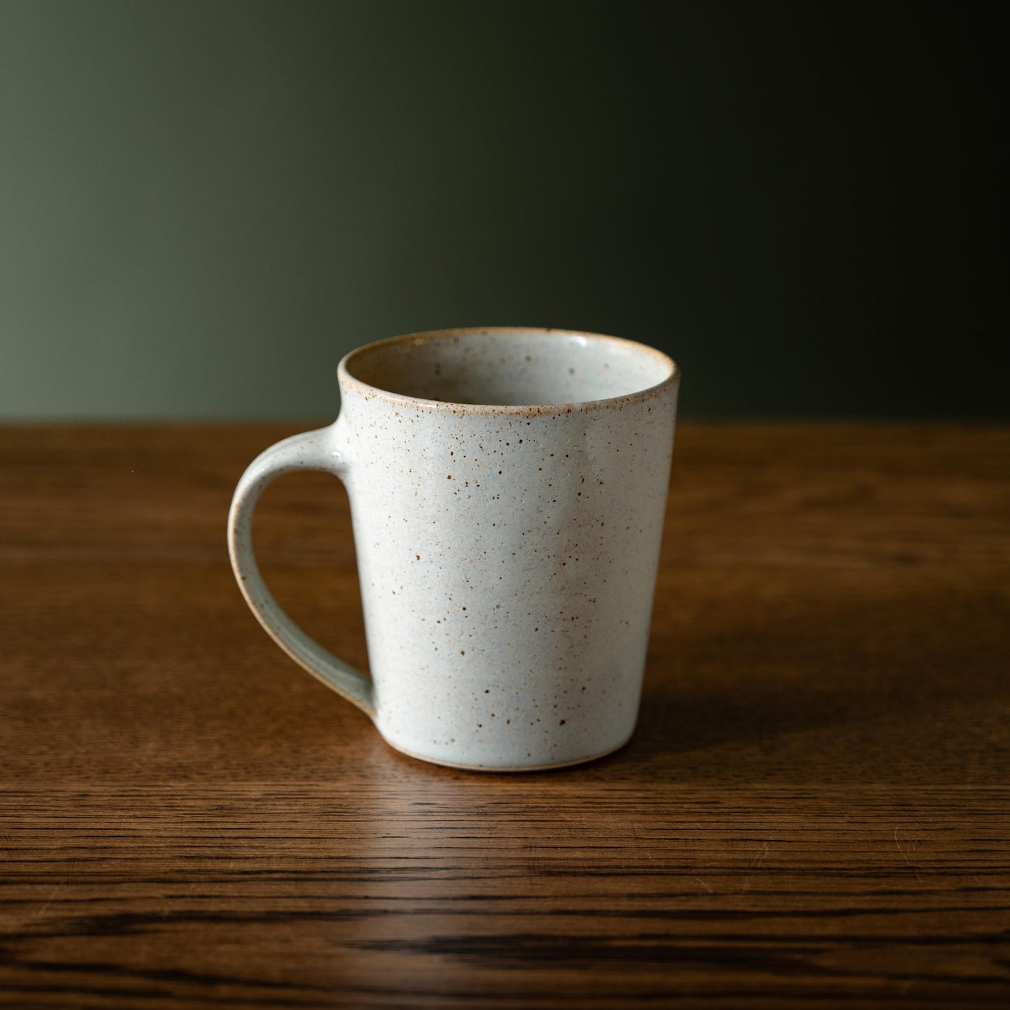 Pottery West tapered mug in powder blue flecked stoneware