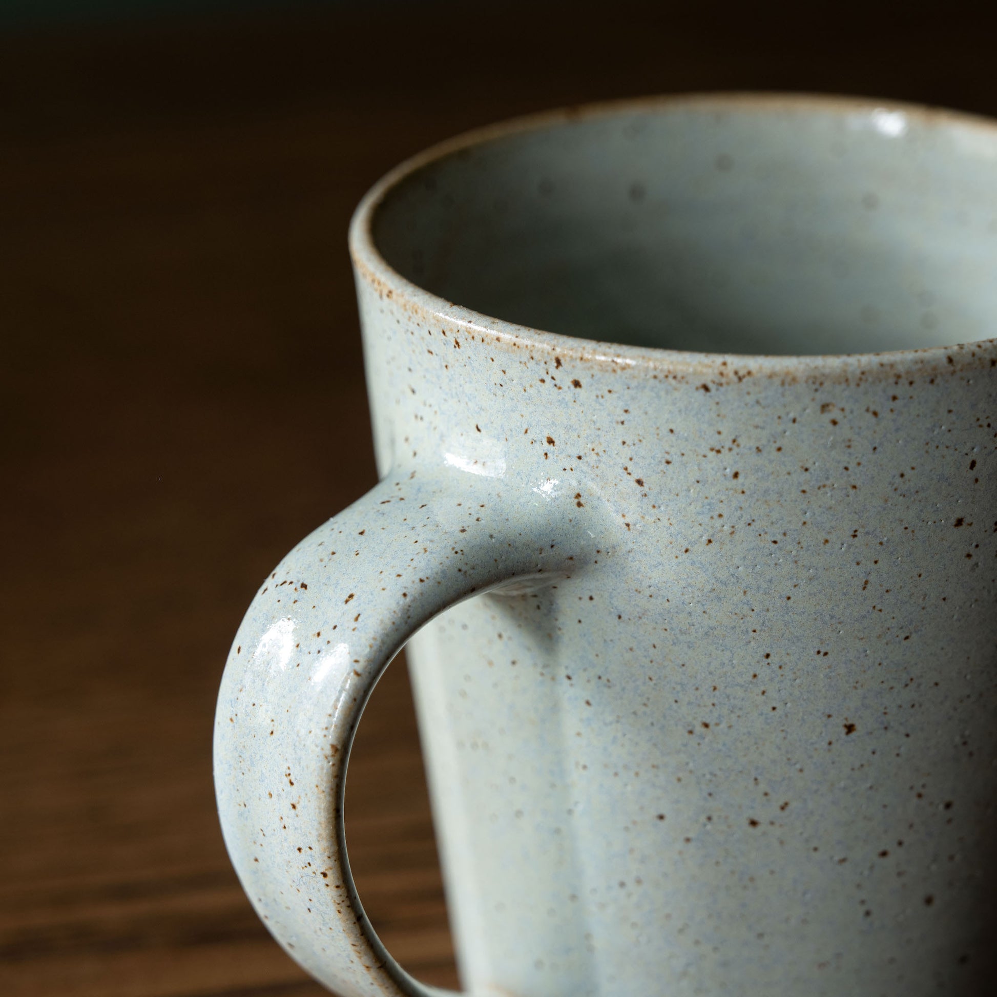 Handle of Pottery West powder blue tapered mug