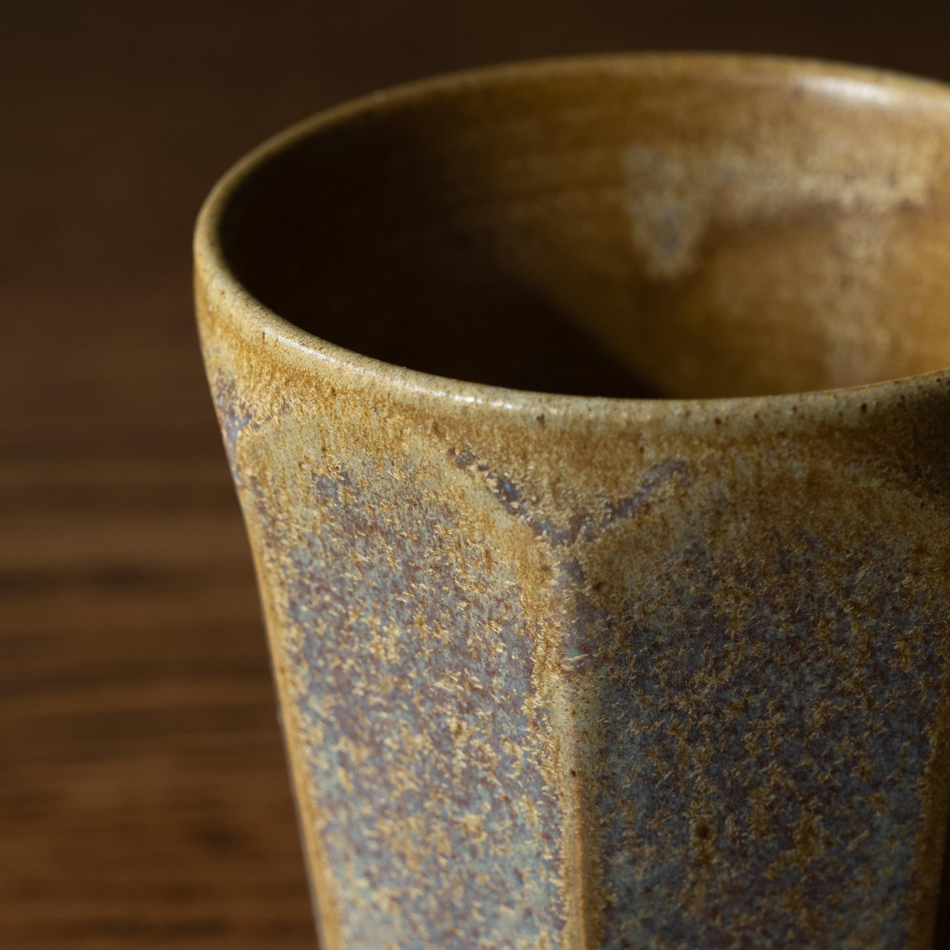 Close-up of Pottery West ochre ceramic beaker 