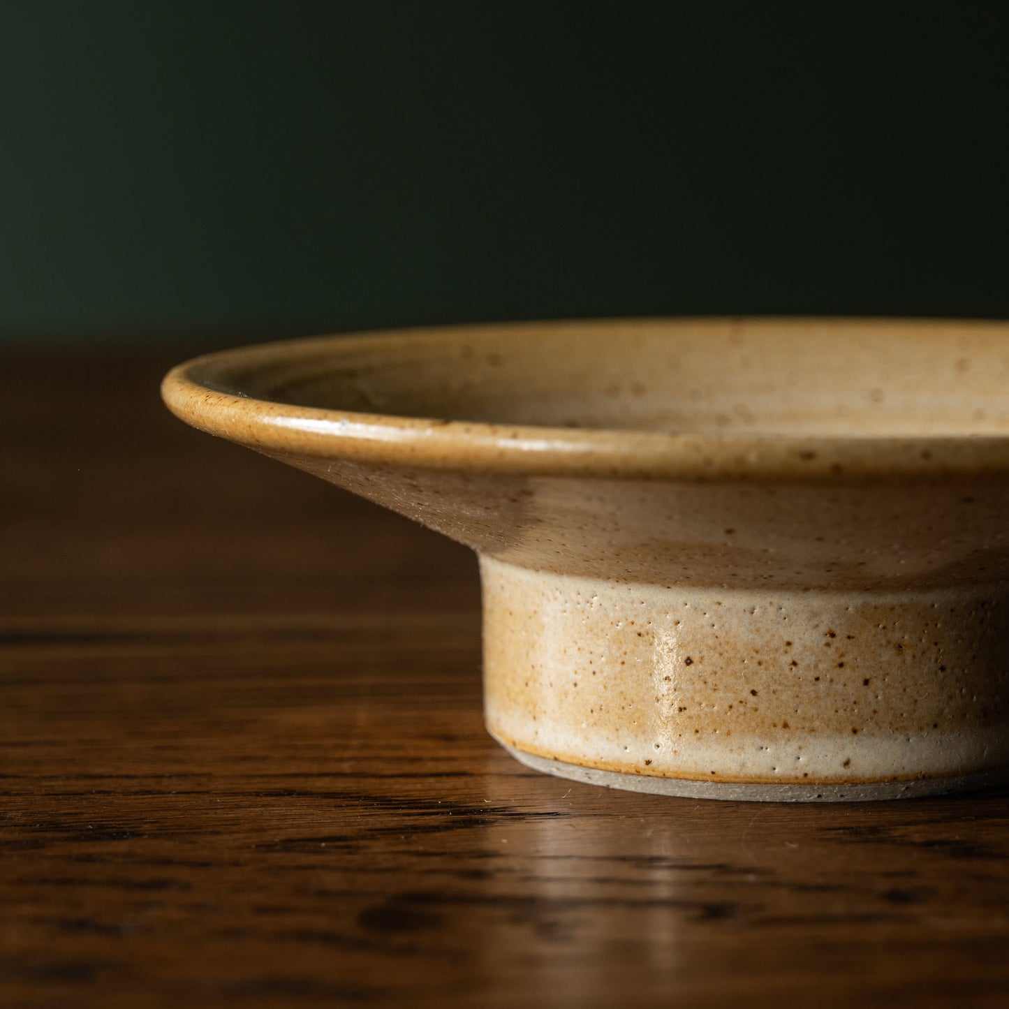 Side profile of the Pottery West stumpie candle holder in sand flecked stoneware