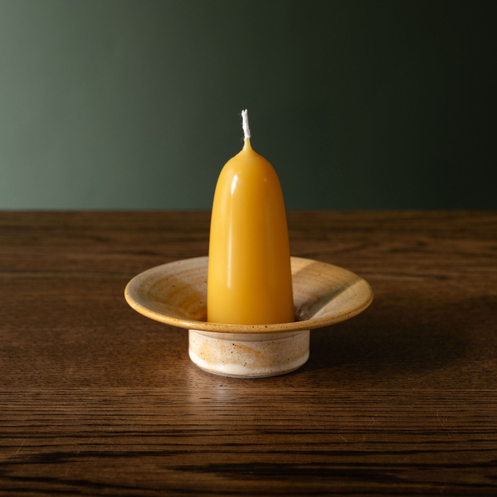 Pottery West sand flecked stoneware stumpie candle holder with beeswax candle