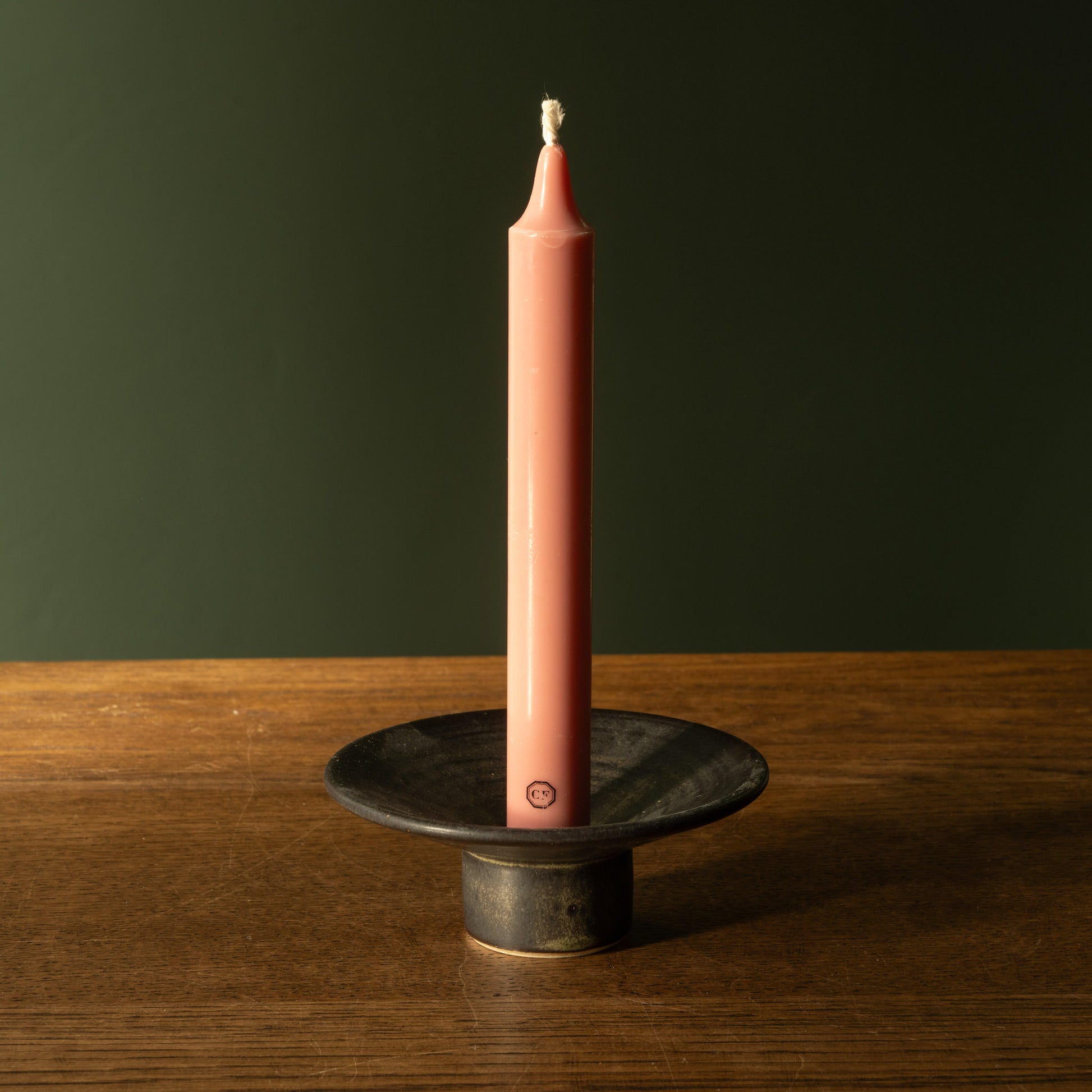Pottery West stoneware dinner candle  holder in charcoal glaze with Carriere Freres taper candle