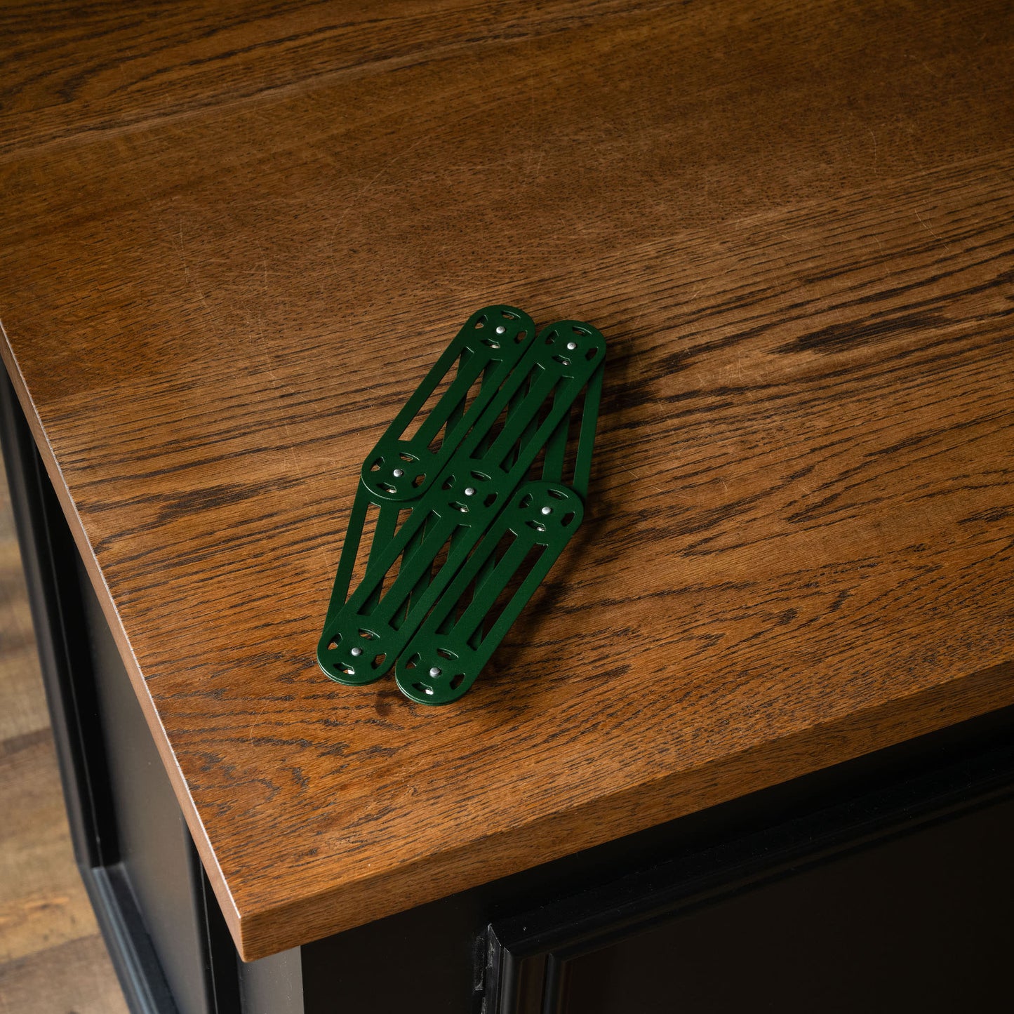 Roger Orfevre pine green steel trivet fully closed 