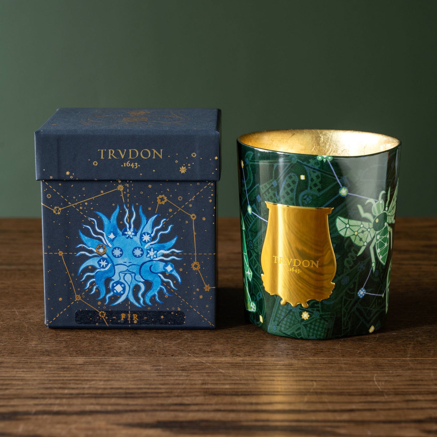 Trudon Enchanted Night Fir Candle with decorative packaging featuring celestial designs 