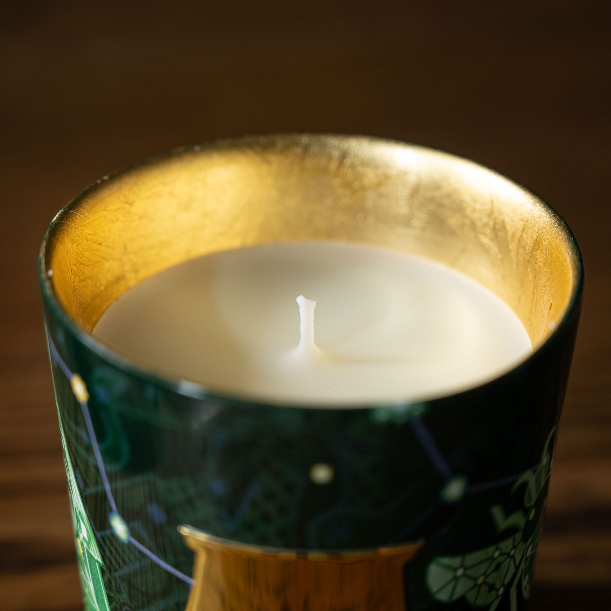 Trudon Fir Candle in a decorative holder with a gold interior