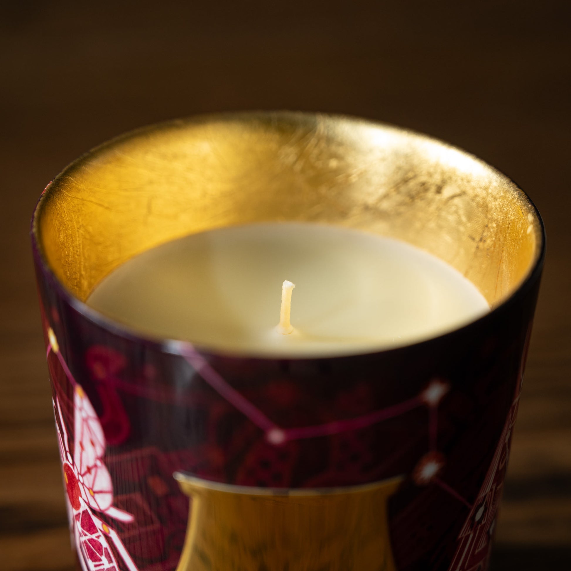 Trudon Nazareth candle wick in a decorative glass holder with a gold inner 