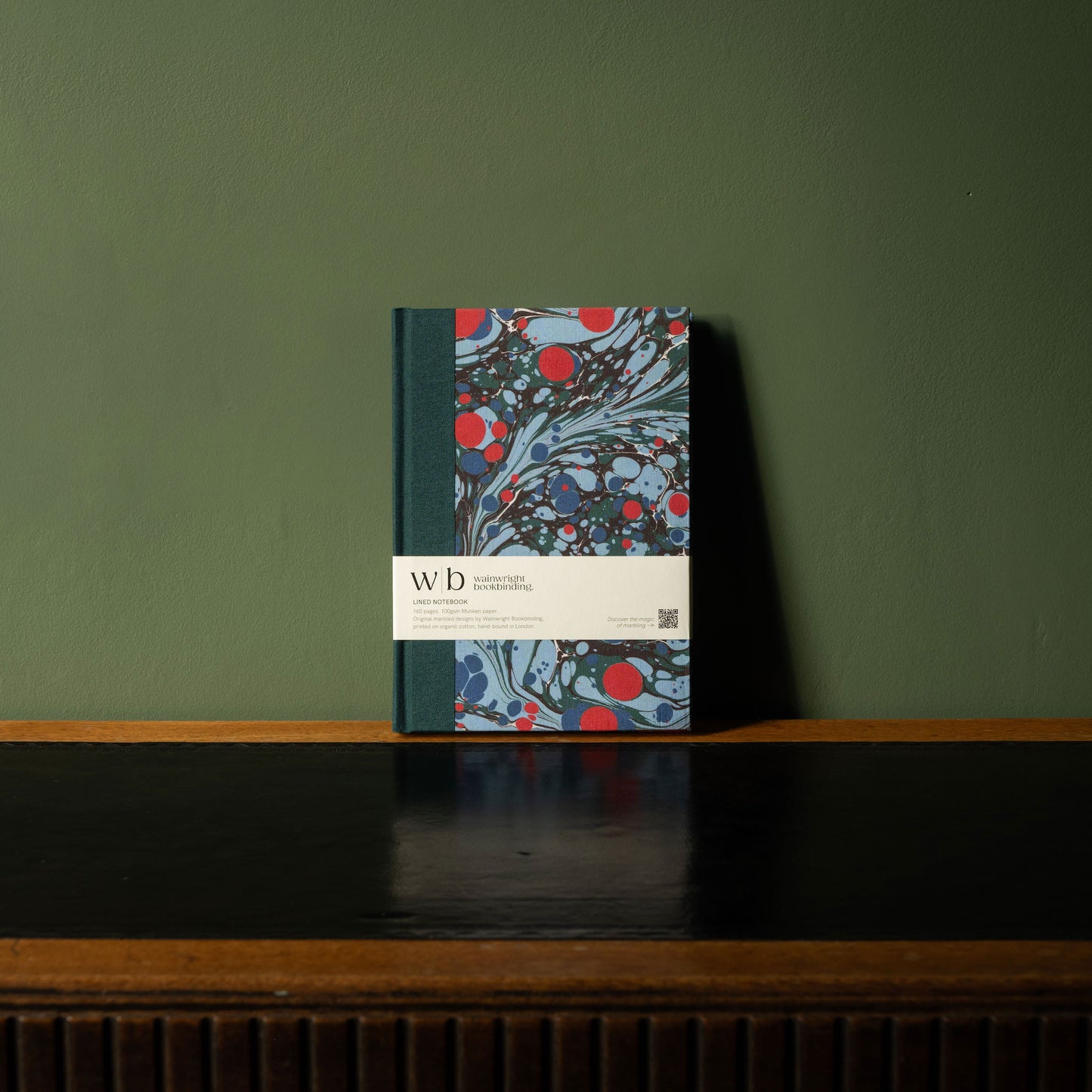 Wainwright Bookbinding notebook with a marbled decorative fabric cover in green, pale blue & red 