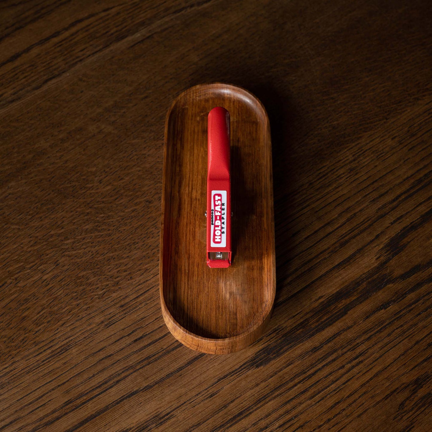 Top view of Penco Red Stapler on pen tray